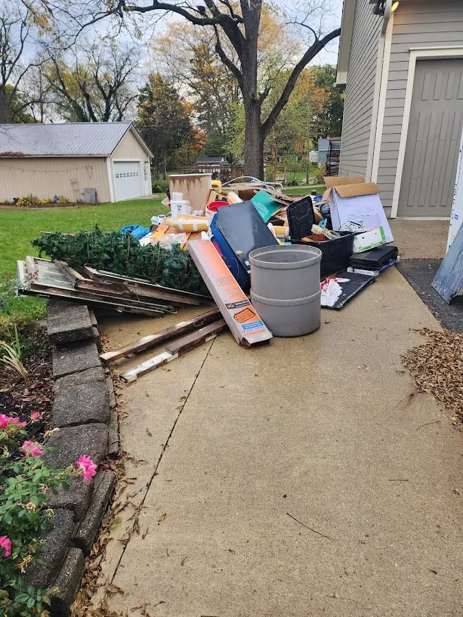 Dumpster being loaded with debris for 30 Yard Dumpster Rental in Hebron